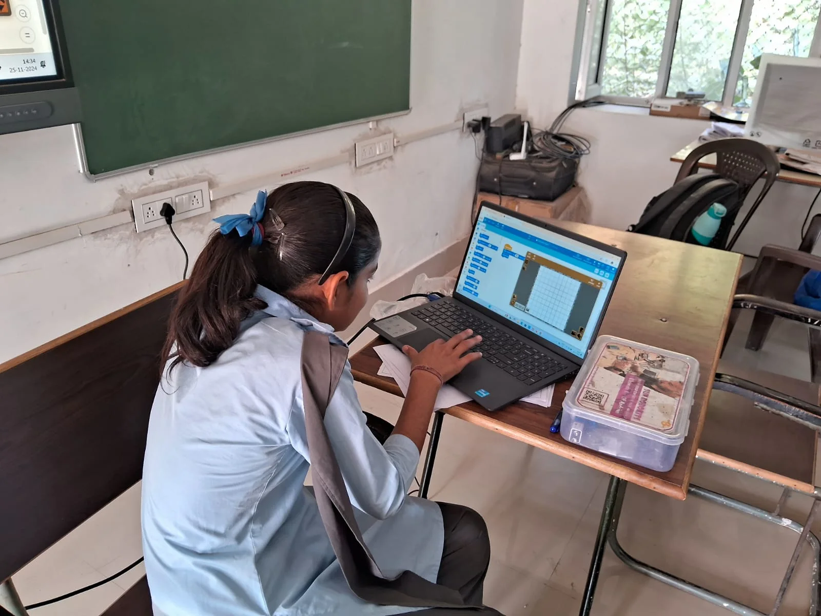 A student practising coding on a school computer