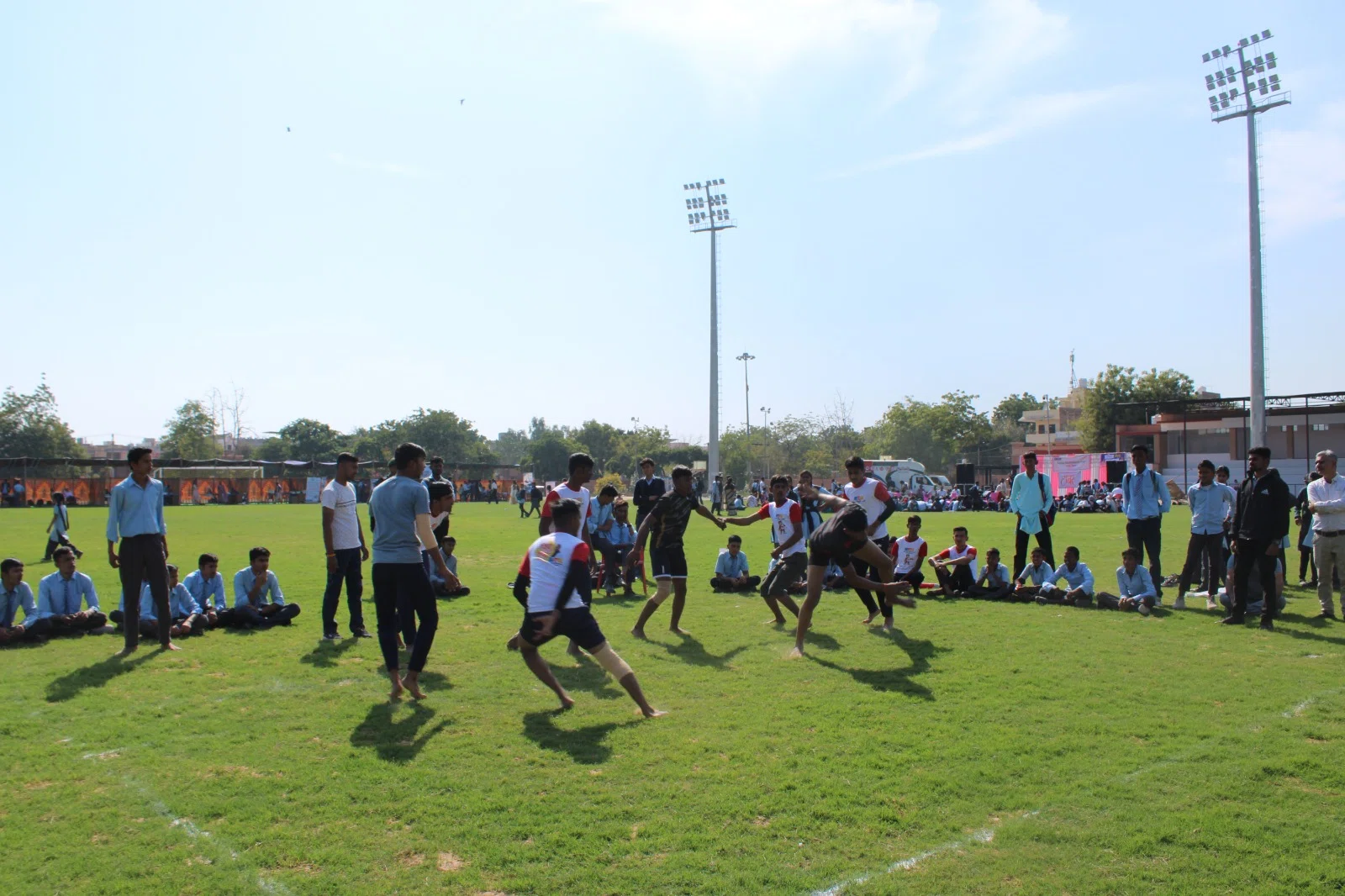 Students running during a game on the fair grounds