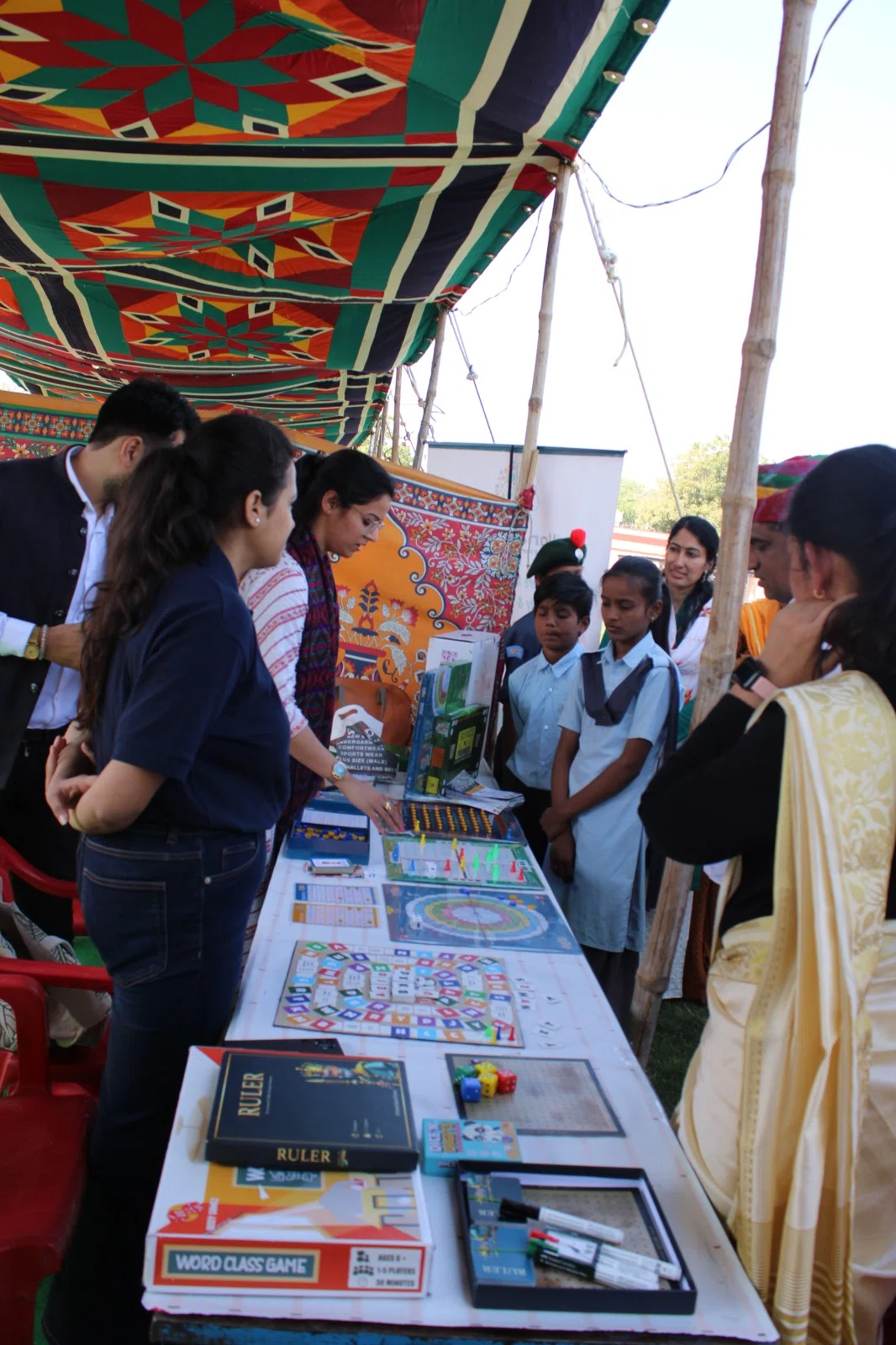 Students visiting educational displays at Taabar Mela