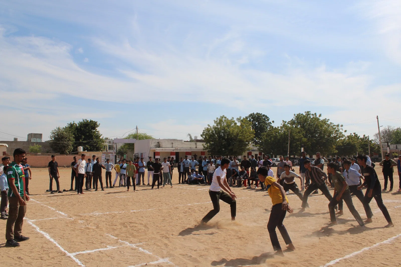 Students competing in a team game on the field