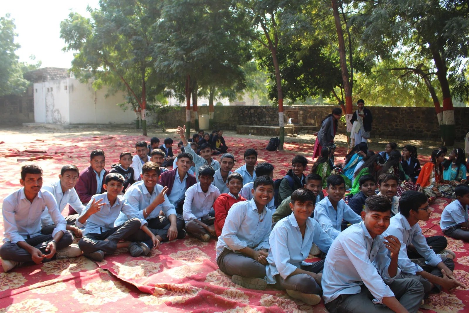 Students gathered in the shade at the fair