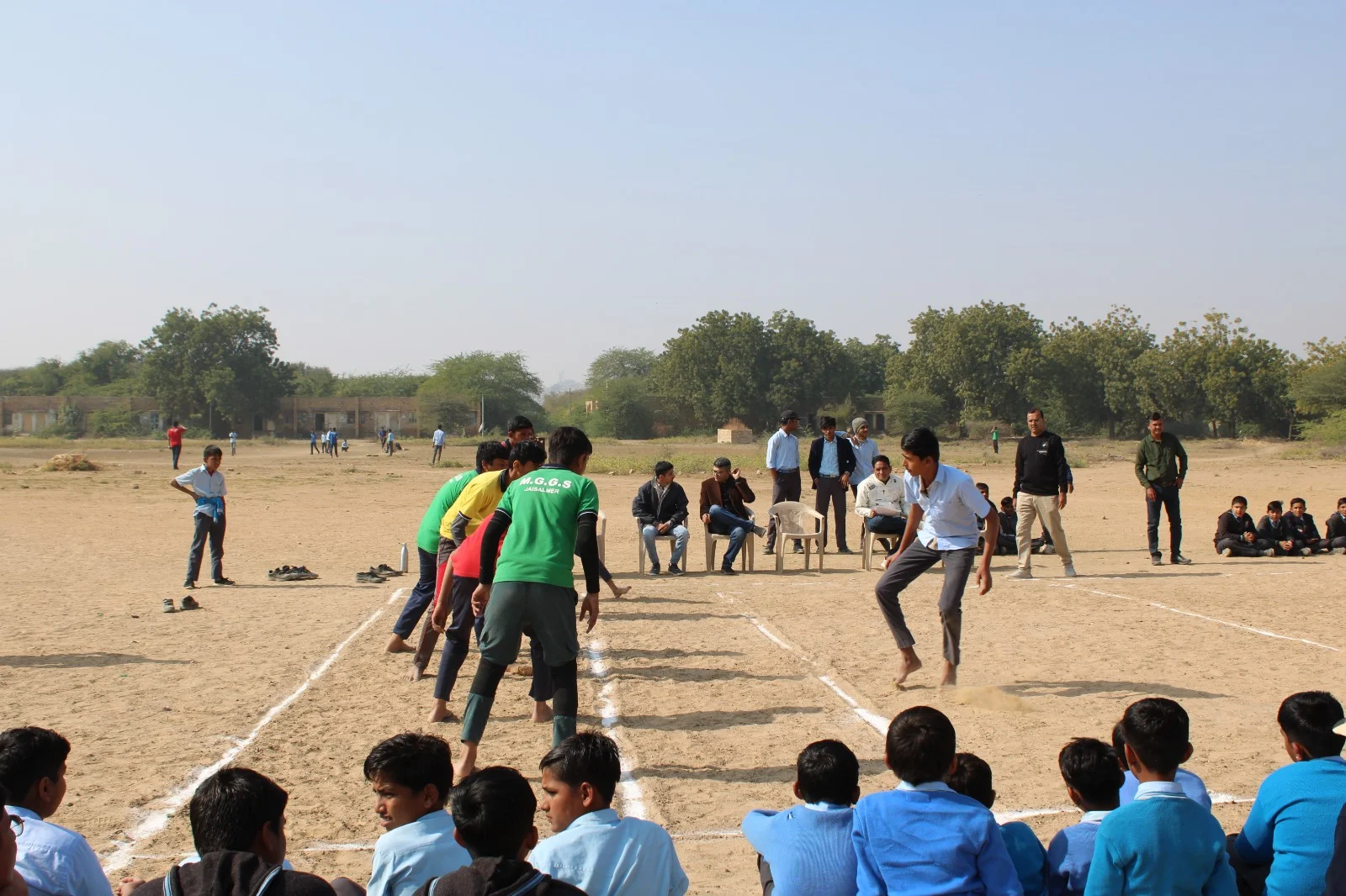Students participating in an outdoor team game