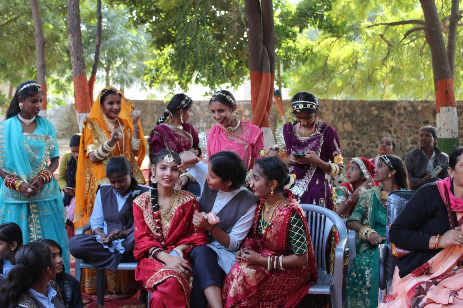 Young performers gathered in colourful costumes