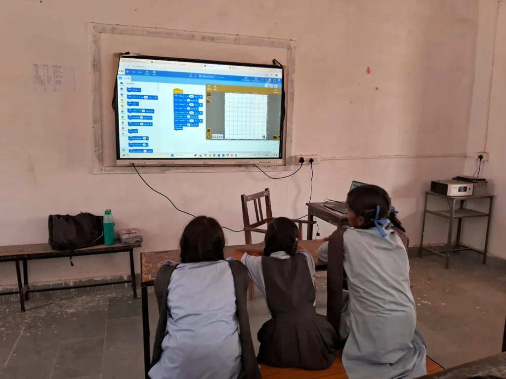 Students practising coding with classroom guidance