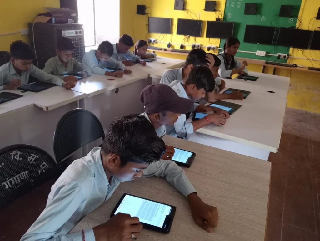 Students completing tablet-based assessments